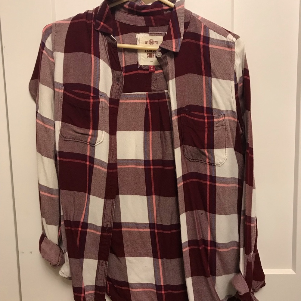 A maroon and white flannel